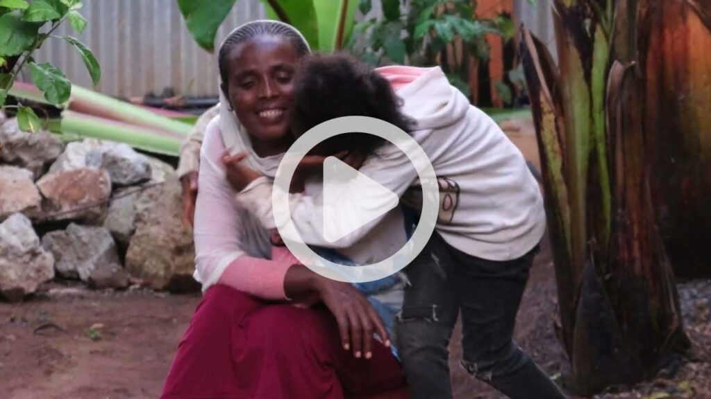Girl hugging woman, Video Play Button